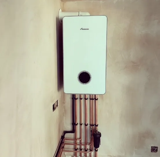 A newly fitted boiler with copper pipework