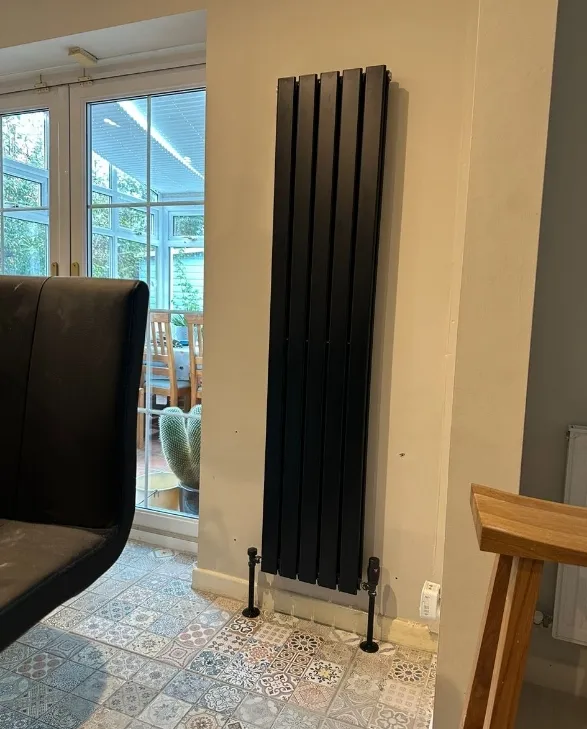 A vertical radiator by the garden doors
